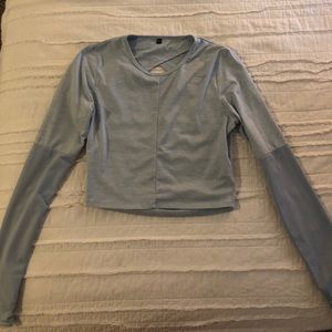 Nikki Blackketter Gymshark light blue top